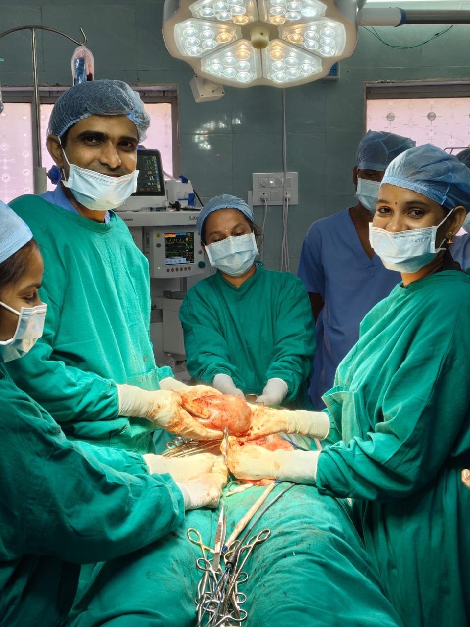 Physician checking patient vitals in general consulting room