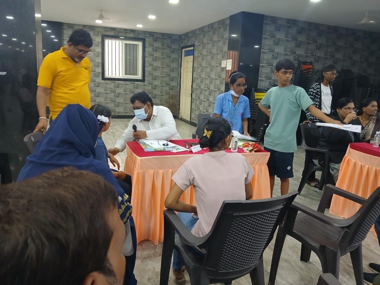 Specialist examining child's chest and breathing