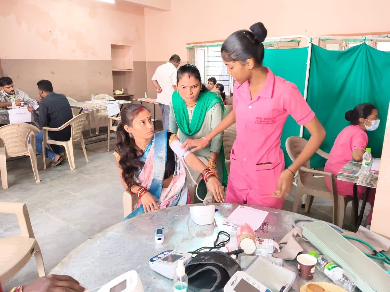 Volunteers managing queue at pediatric screening drive
