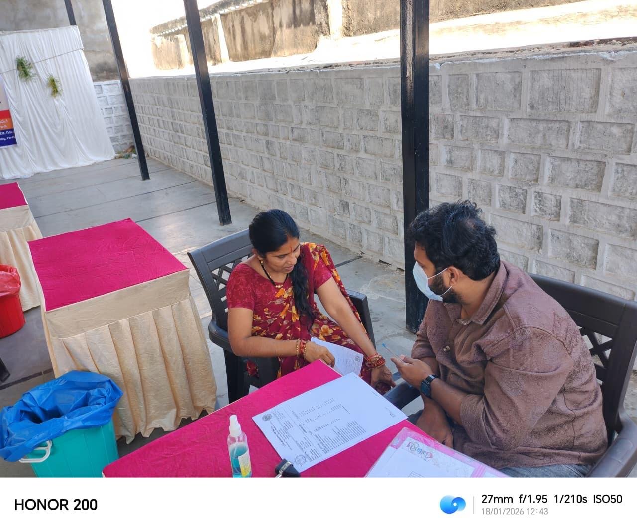 General physician checking patient's shoulder and arm movement
