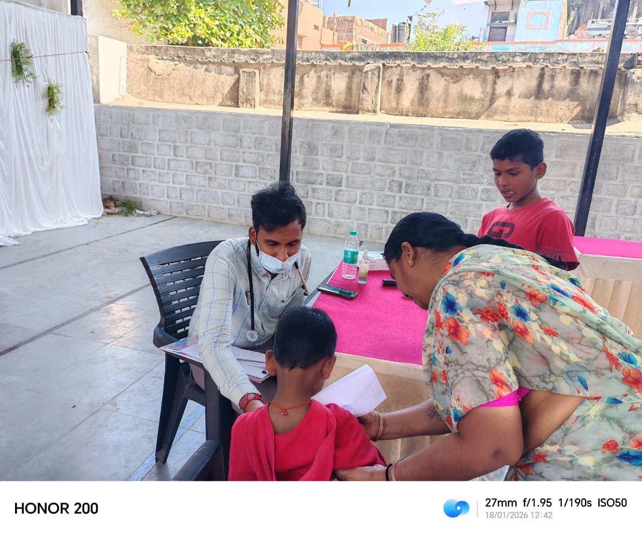Doctor examining patient during clinical consultation